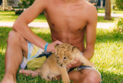 Cute guy with lion cub