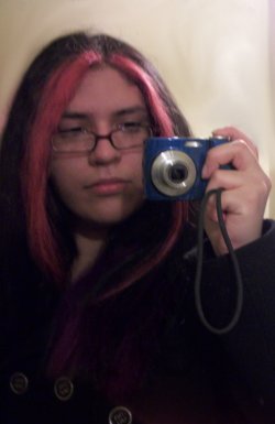 mylifesonoverdrive said i should post a picture of myself ^^ while i&rsquo;m not really a picture person, i remembered that i had this one from December 2010 so i&rsquo;m posting it. the only thing is that i actually have curly hair and the pinkish parts