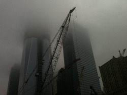 eyeheartnewyork:  The reconstructed World Trade Center, into the fog. Sept. 7, 2011 