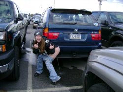 notatoiletnowitis:  Can’t get much classier than a woman Eagles fan pissing behind a BMW.
