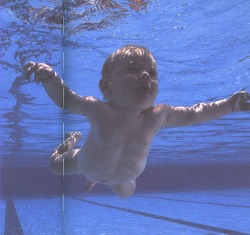 nirvananews: Nirvana - Nevermind. The cover shot was inspired by Kurt and Dave having seen a documentary on underwater birth during recording sessions. They investigated pictures of babies being born underwater, but they were too graphic. Therefore they
