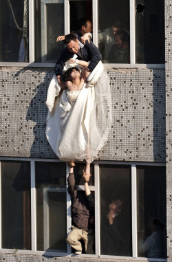 whoresforbreakfast:  The bride surnamed Li cut her wrists and tried to commit suicide after her boyfriend broke up with her just before the marriage.  Look at her face. She’s given up completely. This is the most beautiful picture I’ve seen, honest