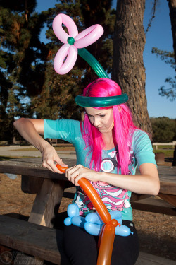 Along with being beautiful, Raven LeFaye has so many unexpected talents, one of which is making kick-ass balloon animals and objects. Here are a few shots of her working her magic, making a flower hat for herself and a plane hat for me. I had stopped