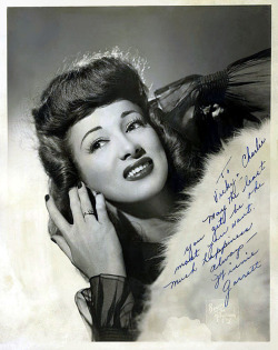     Winnie Garrett   aka. &ldquo;The Flaming Redhead&rdquo;.. Vintage 40’s-era promo photo personalized: “To Vicky &amp; Charlie — May the least you get be the most you want. Much happiness always.. — Winnie Garrett”    