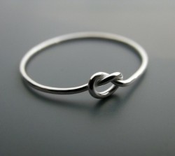  A “knot” ring. The ring symbolizes a knot that is not quite tied yet, but has all intentions of being tied. A promise ring.  