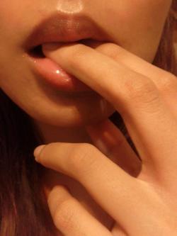 sinsofcommission:  One of my favorite “non-nude” submissions ever! Look at the incredibly sexy lips, shaped for kissing, and for sucking, and to nibble on. Her delicate, beautiful feminine fingers placed in her wet mouth arouse desire, awakening the