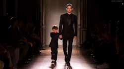 kisslng:   Brazilian model Alexandre Cunha was paired with a three-year-old moptop to showcase Smalto’s matching child-sized and adult tuxedos. Unfortunately, while the pressure of performing didn’t faze the buff Brazilian, his partner broke down