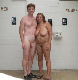 nudistlifestyle:  Naturist couple pose outside changing rooms at local pool. 