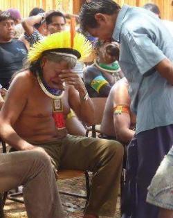 elsimoncabra:  reactiveprocess:  Fucked….   I hope that this image travels the world …“While newspapers and television talk about the lives of celebrities, the chief of the Kayapo tribe received the worst news of his life: Dilma, “The new president