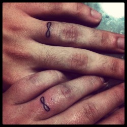 fuckyeahtattoos:  My husband and I just got our first tattoos together; an infinity symbol underneath our wedding bands. Done in Yigo,Guam. I think it’s pretty self explanatory. Love lasts an eternity. 