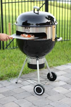 thedailywhat:  Life-Altering Pizza Grilling Accessory of the Day: Transform your trusty Weber One-Touch into a pizza maker worthy of [enter your favorite pizza joint here] with the KettlePizza pizza oven sleeve.  Imagine cooking real wood-fired pizza