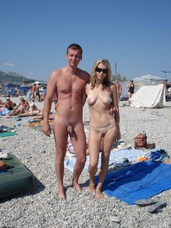nudistlifestyle:  Nudist couple pose for a photo at the beach !  the cool place to let it hang out