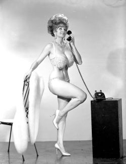 Tempest Storm takes an important phonecall.. A late 60&rsquo;s-era promo photo..