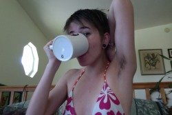 howling-cat-tongues:  Proud of my lovely pit hair.  Drinking delicious coffee from my Mighty Boosh mug. Its a glorious day outside so I’m going to go lay out in the sun a read a book. (reason I’m wearing a bikini top.)  