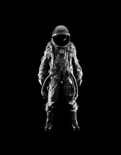 dawnawakened:  Emerging from a void, Andrew G. Hobbs‘ hallowed portrait of an astronaut is striking. Looking over the many space suits that we have put up here over time, most are the Luke Skywalker types in their white, pillowy Apollo suits that embody