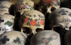 chocolateoatmilk:  theoddmentemporium:  This is the eerie ‘Bone House’, or ‘Beinhaus’ - home to an estimated 1,200 skulls. Many have been painted with symbolic floral crowns and the name of the deceased before being placed in the spooky building