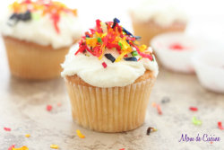gastrogirl:  coconut vanilla bean cupcakes with rainbow coconut sprinkles. 