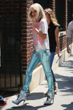Miranda Kerr. ♥  Looking so cute in a blonde wig, silver top, blue sequined trousers and metallic shoe boots. ♥