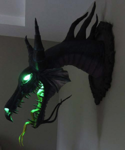 campusbeef:  bigbadbroseidon:  iheartchaos:  Geekcraft of the day: Maleficent dragon papercraft wall mount Using paper and some lights, Dan Reeder made this ultra badass wall mount based on the dragon form of Maleficent from Disney’s Sleeping Beauty.