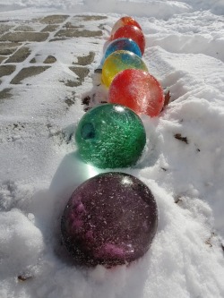  Fill balloons with water and add food colouring, once frozen cut the balloons off and they look like giant marbles. 