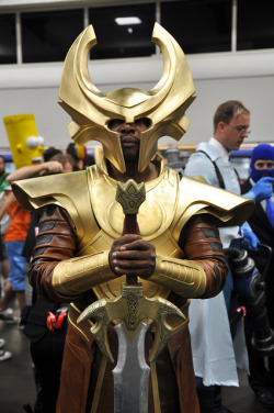 glayish:  face-down-asgard-up:  thelittlekneesofbees:  searchingforknowledge:  madamethursday:  [Image: An incredible cosplay with a Black person wearing a full costume of Heimdall from the Thor film, holding a sword by the hilt, sword point down, looking