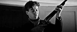 exponential63:  With a gun like that, you knew where this was leading. Not my GIFS: just beautiful. Vintage phallic-barrel-fondling Alec Scudder (Maurice, 1987) by the-master-of-deduction. Rupert as Riddell (Doctor Who Season 7, 2012) by jamanddogtags.