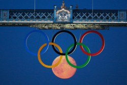 Moon Rises over the Olympic Rings at Tower Bridge in London