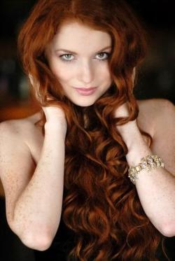 Beautiful redhead with long hair and freckles.