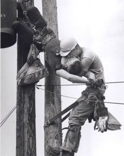 collectivehistory:  “Kiss of Life”, 1968 Pulitzer Prize A utility worker, J.D. Thompson, is suspended on a utility pole and giving mouth to mouth resuscitation to a fellow lineman, Randall G. Champion, who was unconscious and hanging upside down after
