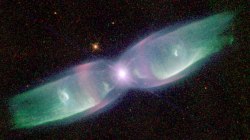 cuboneandmarowak:  A planetary nebula, the final stage of a low-mass star’s life as it casts off its gaseous envelope and becomes a white dwarf.Two stars orbit inside a gaseous disk.The expelled envelope of the dying star breaks out from this disk to