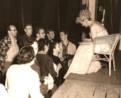   Sally Rand A press photo from 1952, features legendary Sally Rand signing autographs for another group of young fans.. After a performance that appears to have been given, while she was touring on the Carnival circuit..  
