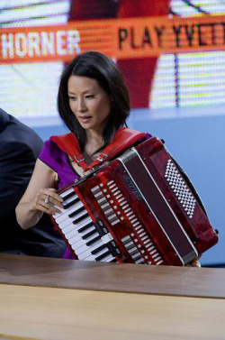 elle-lavender:  freckledhoney:  When I read that Lucy Liu played the accordion, I was like “yeah right!” But then I found these pictures and the following anecdote:  Greg Germann, who plays [Richard] Fish, Liu’s love interest on [Ally McBeal], is