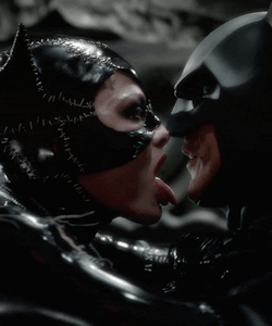 punkrockbetty:  You got to lick Michael Keaton… I hate you, Michelle Pfeiffer. XoX Britt.  Worst batman EVER