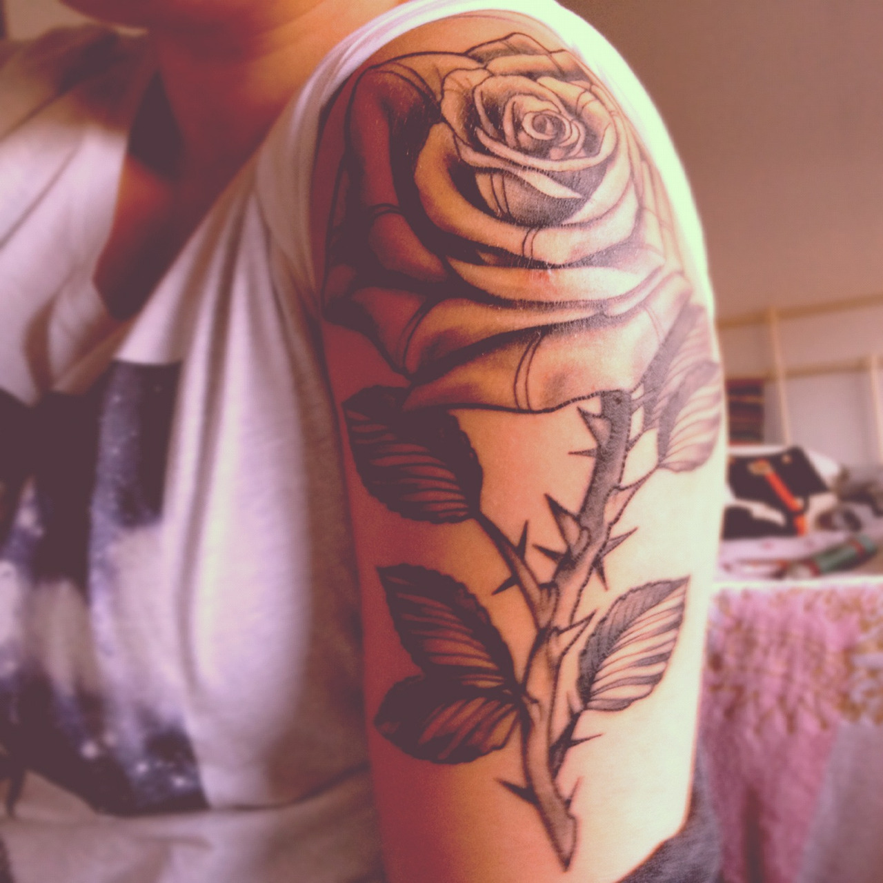 Upper arm rose tattoos for women